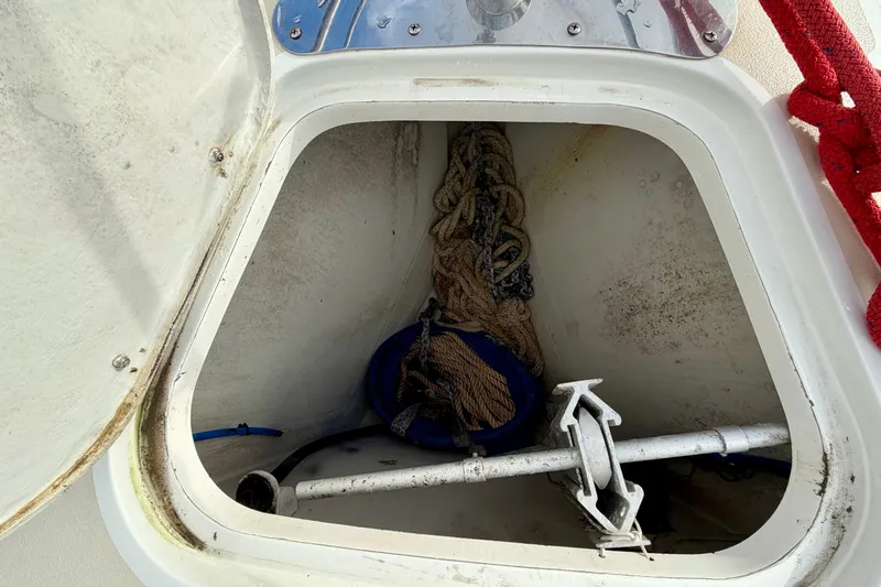 Kittywake Yacht Photos Pics Anchor locker of a 1996 J Boats J/42 sailboat with ropes and anchor.