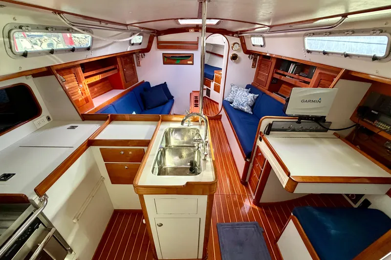 Kittywake Yacht Photos Pics Interior of 1996 J Boats J/42 sailboat with wood finish and modern amenities.
