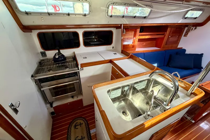 Kittywake Yacht Photos Pics Interior of 1996 J Boats J/42 sailboat with kitchen and seating area.