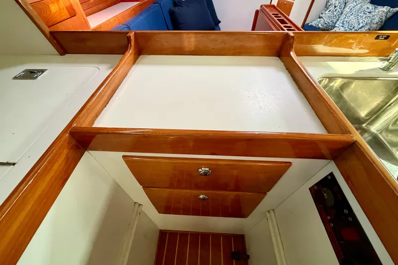 Kittywake Yacht Photos Pics Interior of 1996 J Boats J/42 sailboat with wooden cabinetry and stainless steel sink.