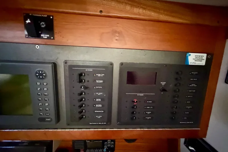 Kittywake Yacht Photos Pics Electrical control panel on a 1996 J Boats J/42 sailboat, featuring various switches and displays.