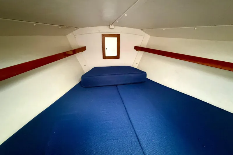 Kittywake Yacht Photos Pics Interior cabin of 1996 J Boats J/42 with blue cushions and wooden accents.