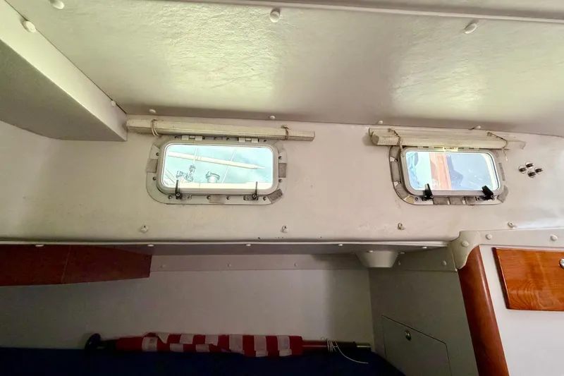 Kittywake Yacht Photos Pics Interior cabin view of a 1996 J Boats J/42 sailboat, featuring two small windows.