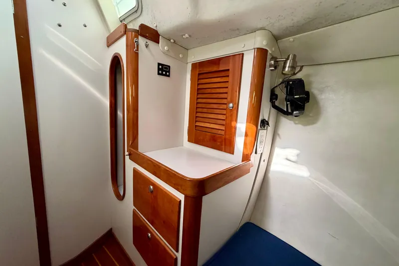 Kittywake Yacht Photos Pics Interior of 1996 J Boats J/42 sailboat with wooden cabinetry and seating.