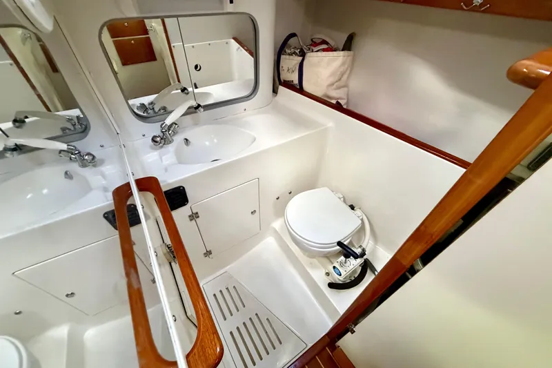 Kittywake Yacht Photos Pics Bathroom interior of 1996 J Boats J/42 yacht, featuring sink and toilet.