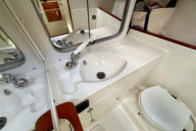 Kittywake Yacht Photos Pics Bathroom interior of 1996 J Boats J/42 yacht with sink and toilet.