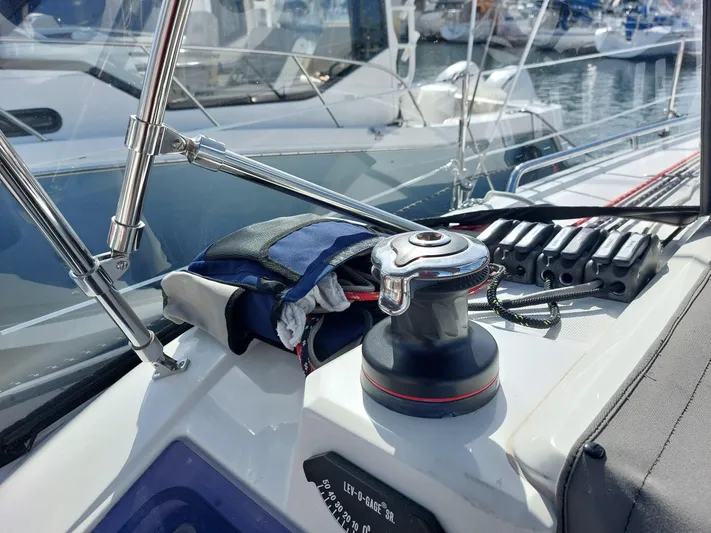 "makai" Yacht Photos Pics Winch and ropes on a 2020 Beneteau Oceanis 30.1 sailboat deck in a marina.
