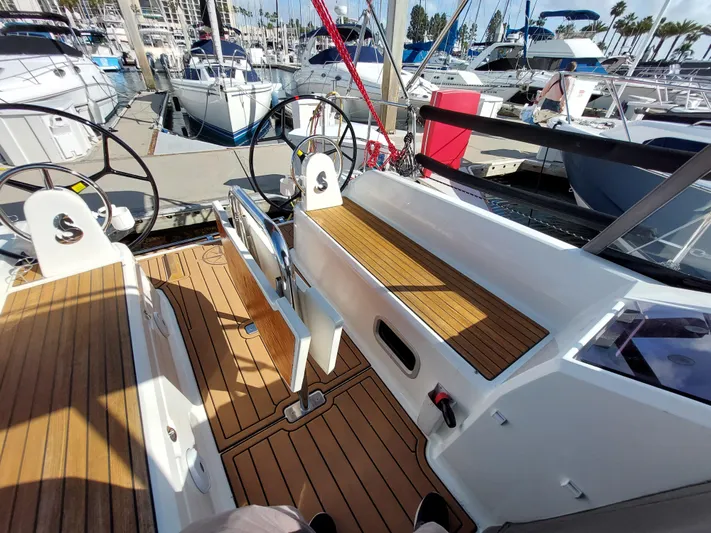 "makai" Yacht Photos Pics Beneteau Oceanis 30.1 sailboat cockpit with dual steering wheels, docked at marina, 2020 model.