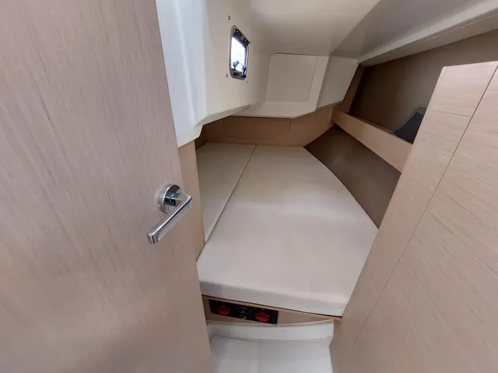 "makai" Yacht Photos Pics Cabin interior of 2020 Beneteau Oceanis 30.1 sailboat, featuring a cozy sleeping area.