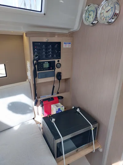 "makai" Yacht Photos Pics Interior of 2020 Beneteau Oceanis 30.1 yacht with control panel and microwave.