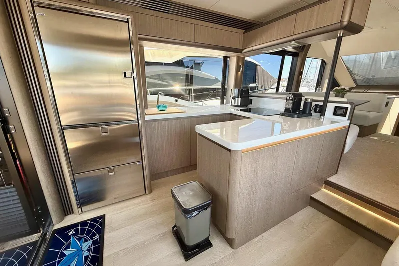  Yacht Photos Pics Luxurious 2024 Galeon 560 Fly yacht kitchen with modern appliances and sleek design.