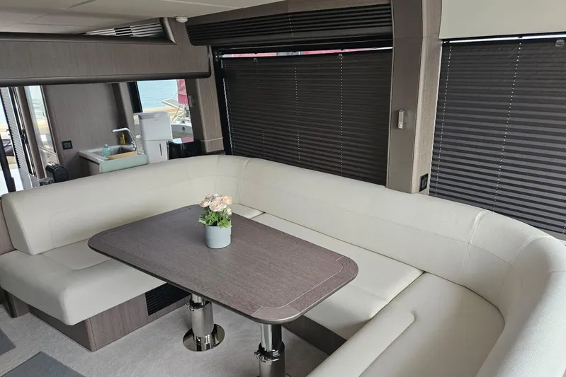  Yacht Photos Pics Luxurious interior of 2024 Galeon 560 Fly yacht with elegant seating and table.