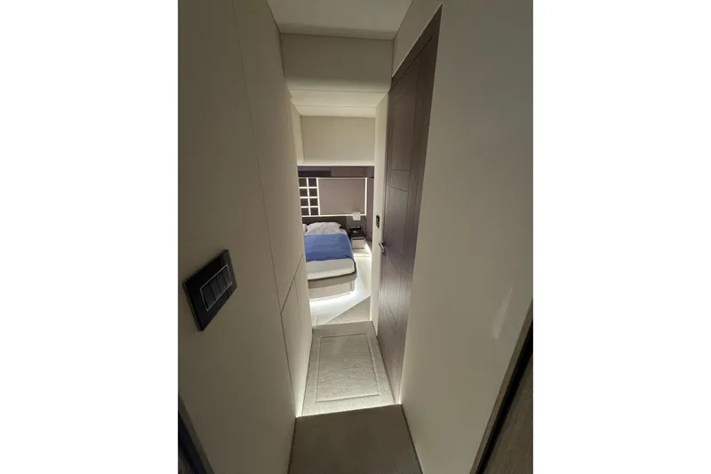  Yacht Photos Pics Luxurious interior cabin of 2024 Galeon 560 Fly yacht, featuring a cozy bed.