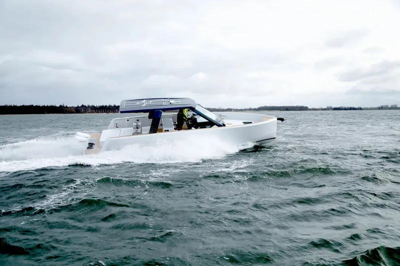  Yacht Photos Pics 2026 Fjord 39 XP yacht cruising on open water under cloudy skies.