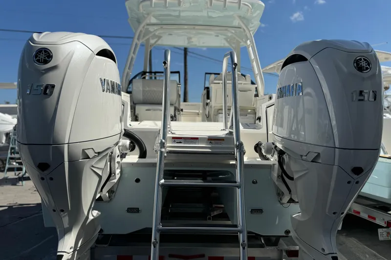 57800 265dc Sf Yacht Photos Pics 2026 World Cat 265 DC-X boat with dual Yamaha 150 engines, ladder, and seating.