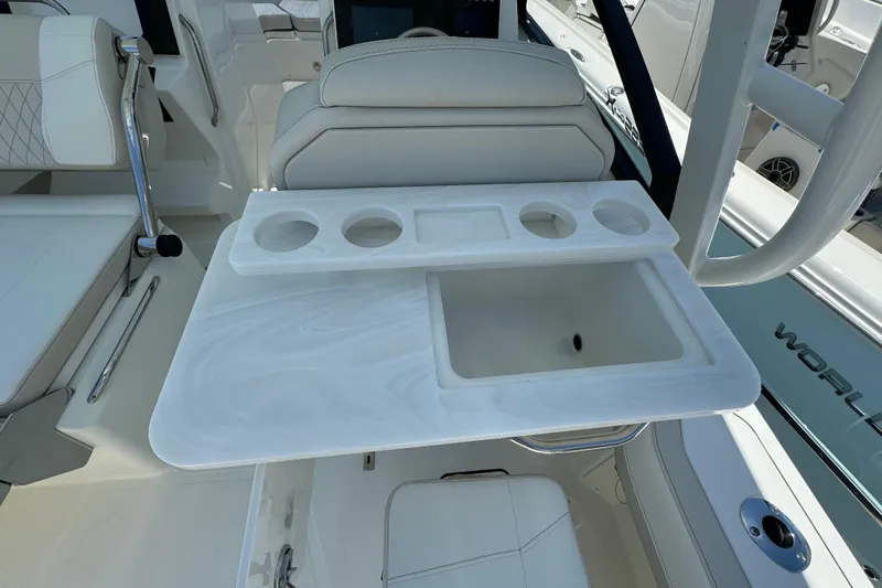 57800 265dc Sf Yacht Photos Pics 2026 World Cat 265 DC-X boat interior with white seating and integrated cup holders.