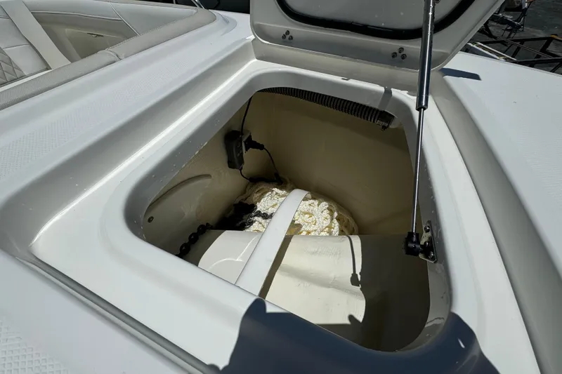 57800 265dc Sf Yacht Photos Pics Open storage compartment on 2026 World Cat 265 DC-X boat, showing interior details.