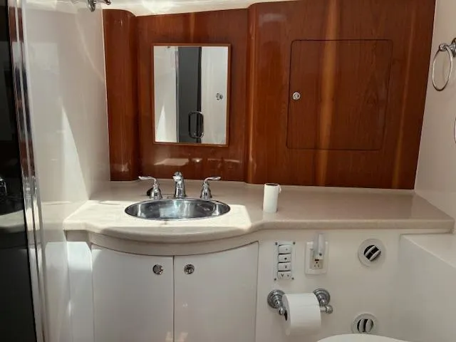  Yacht Photos Pics Luxurious bathroom in 2009 Intrepid 475 Sport Yacht with wood accents and modern fixtures.