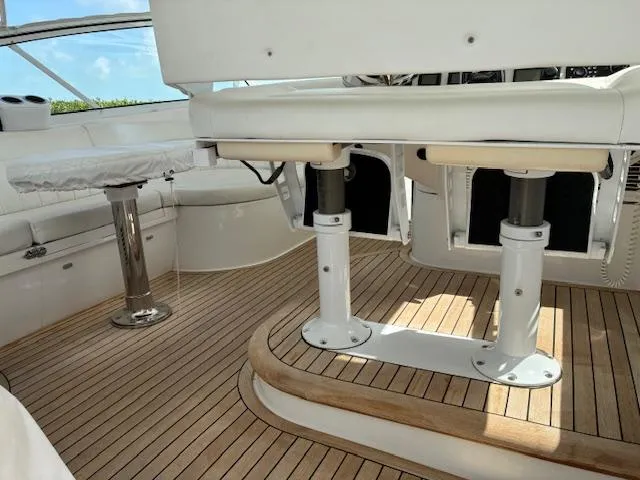  Yacht Photos Pics 2009 Intrepid 475 Sport Yacht interior with teak flooring and white seating.