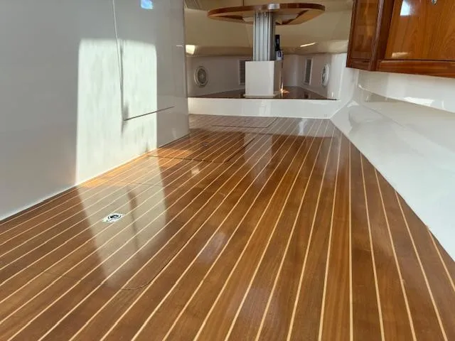  Yacht Photos Pics Intrepid 475 Sport Yacht 2009 interior with polished wooden flooring and sleek design.
