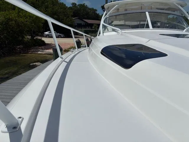  Yacht Photos Pics 2009 Intrepid 475 Sport Yacht deck view with sleek design and railing.