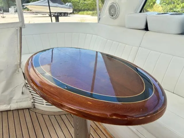  Yacht Photos Pics Luxurious interior of 2009 Intrepid 475 Sport Yacht with elegant wooden table.