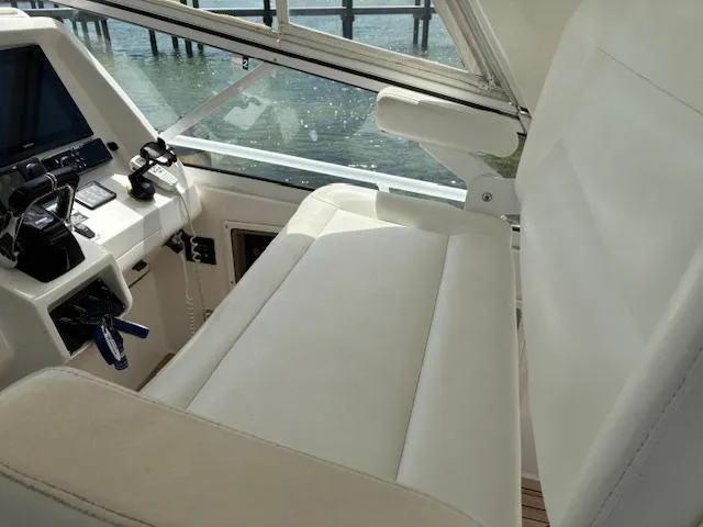  Yacht Photos Pics Interior of 2009 Intrepid 475 Sport Yacht with helm seat and control panel.