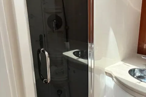  Yacht Photos Pics 2009 Intrepid 475 Sport Yacht bathroom with sleek shower and modern sink.