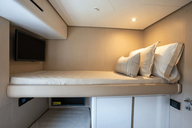  Yacht Photos Pics Interior of 2026 Azimut Fly 68 yacht with cozy bed and TV.