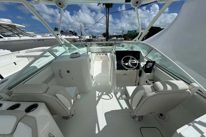57582 230sd Sf Yacht Photos Pics Interior view of 2026 World Cat 230 SD boat, featuring modern helm and seating.