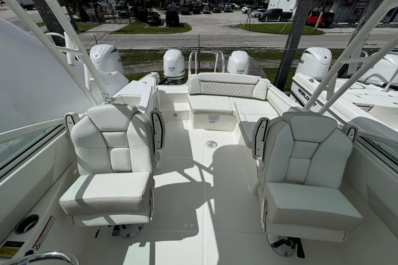 57582 230sd Sf Yacht Photos Pics 2026 World Cat 230 SD boat interior with white seating and dual outboard motors.