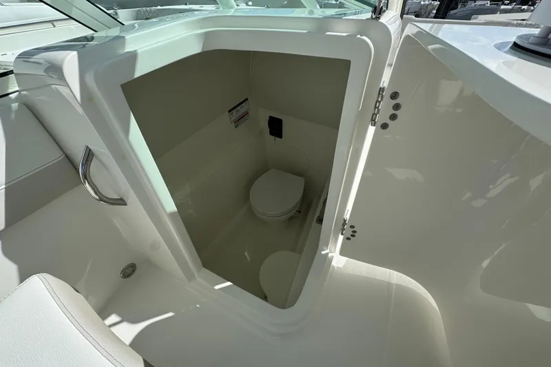 57582 230sd Sf Yacht Photos Pics Interior view of 2026 World Cat 230 SD boat's compact bathroom.