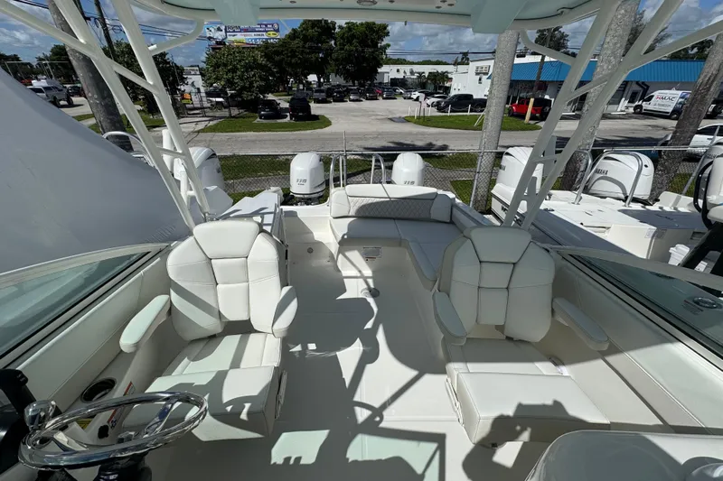 57582 230sd Sf Yacht Photos Pics 2026 World Cat 230 SD boat interior with white seating and dual engines.