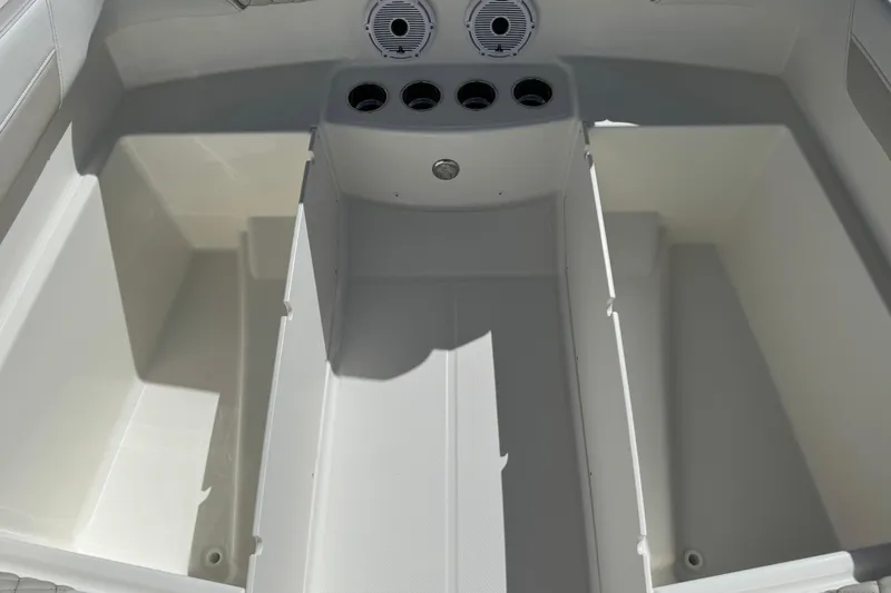 57582 230sd Sf Yacht Photos Pics 2026 World Cat 230 SD boat interior storage compartments with cup holders and speaker.