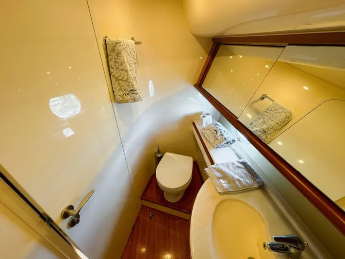 Azimut 62 Evolution Yacht Photos Pics Luxurious bathroom in 2007 Azimut 62 Evolution yacht with elegant fixtures and mirrored wall.