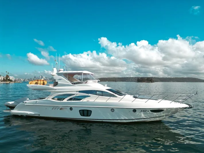 Azimut 62 Evolution Yacht Photos Pics 2007 Azimut 62 Evolution yacht on calm water under a clear blue sky.