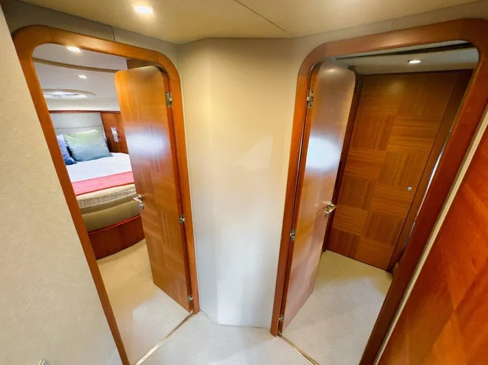 Azimut 62 Evolution Yacht Photos Pics Interior of 2007 Azimut 62 Evolution yacht showing two wooden doors leading to cabins.