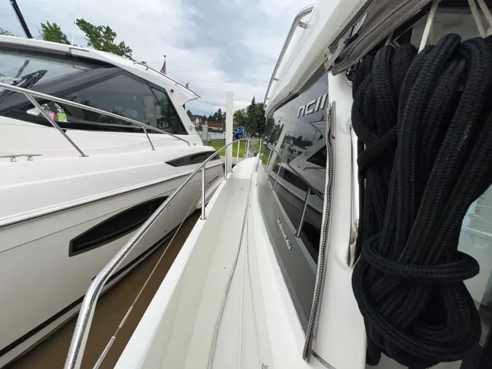  Yacht Photos Pics 2017 Jeanneau NC11 yacht docked, showcasing sleek design and modern features.