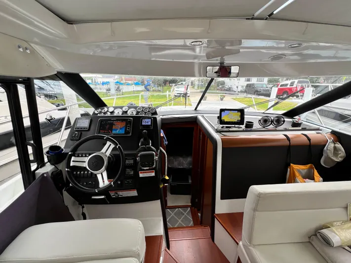  Yacht Photos Pics 2017 Jeanneau NC11 boat interior with modern helm and navigation equipment.