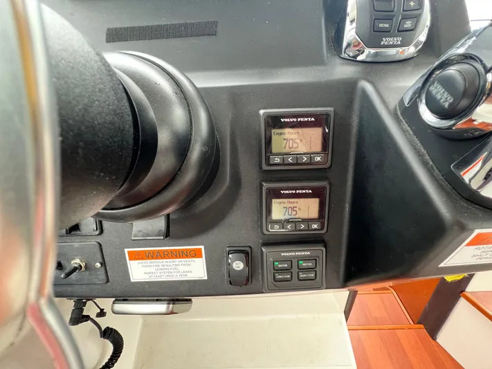  Yacht Photos Pics Control panel of a 2017 Jeanneau NC11 boat showing engine hours and Volvo Penta controls.