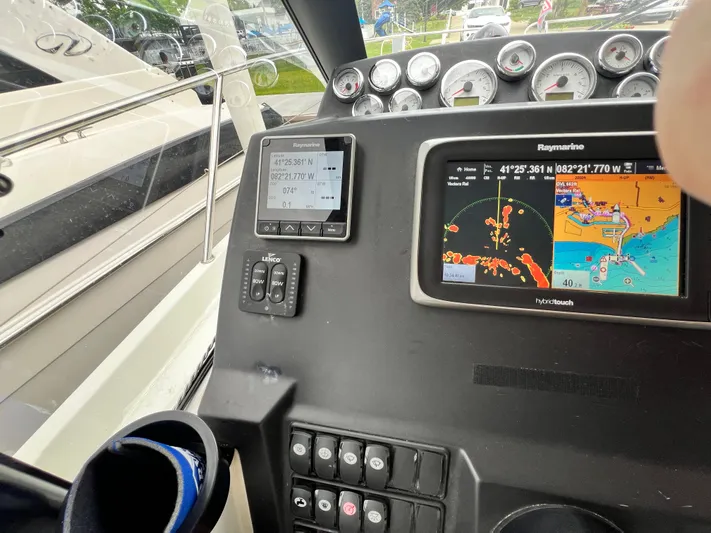  Yacht Photos Pics Control panel of a 2017 Jeanneau NC11 boat with navigation screens and gauges.