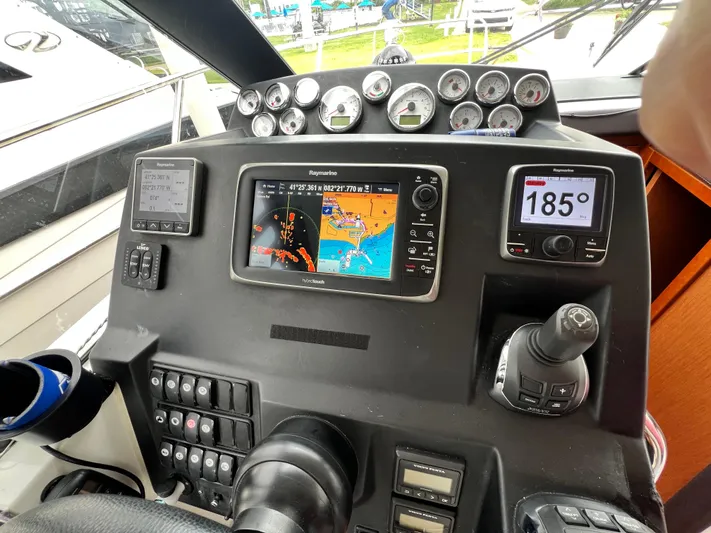  Yacht Photos Pics Cockpit of 2017 Jeanneau NC11 with navigation instruments and control panel.