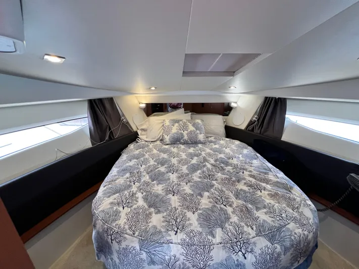  Yacht Photos Pics 2017 Jeanneau NC11 cabin with cozy bed and elegant decor.