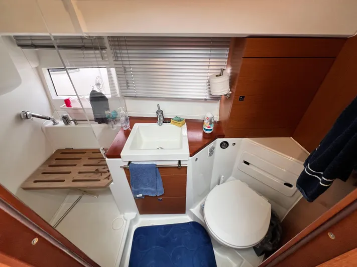  Yacht Photos Pics 2017 Jeanneau NC11 bathroom with sink, toilet, and shower area.