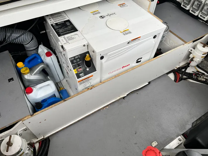  Yacht Photos Pics Engine room of 2017 Jeanneau NC11 with Cummins Onan generator and fluid containers.
