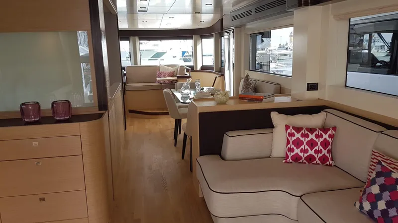  Yacht Photos Pics Luxurious interior of 2018 Sirena 64 yacht with elegant seating and dining area.