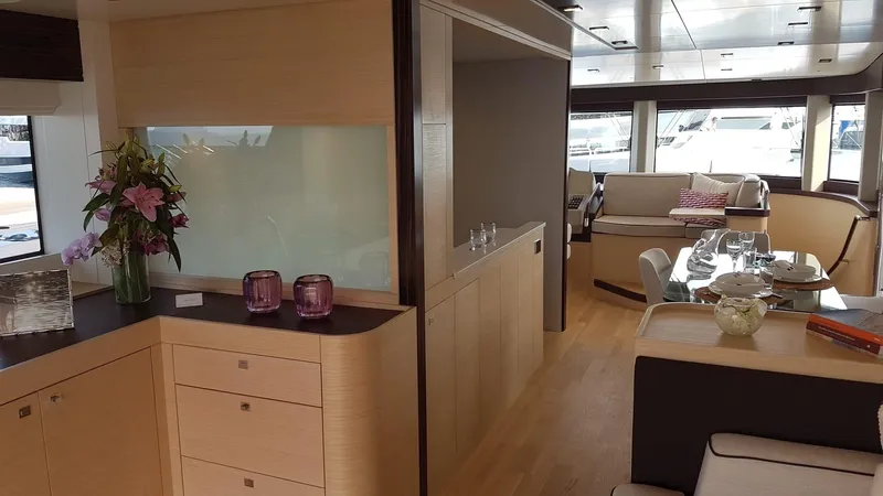  Yacht Photos Pics Luxurious interior of 2018 Sirena 64 yacht with elegant dining and seating areas.