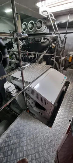  Yacht Photos Pics Engine room of 2018 Sirena 64 yacht with visible machinery and metal flooring.