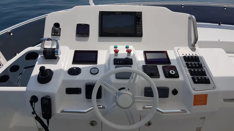  Yacht Photos Pics Cockpit of 2018 Sirena 64 yacht with navigation controls and display screens.