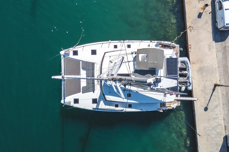  Yacht Photos Pics Aerial view of 2023 Fountaine Pajot Astrea 42 Maestro catamaran docked at marina.